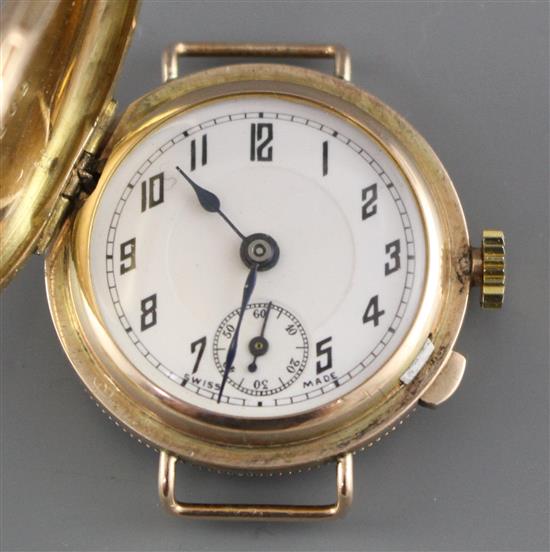 A ladys 1930s yellow metal (stamped 9c) Golfball? manual wind wristwatch, with hinged cover, no strap,